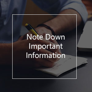 person writing text on notebook